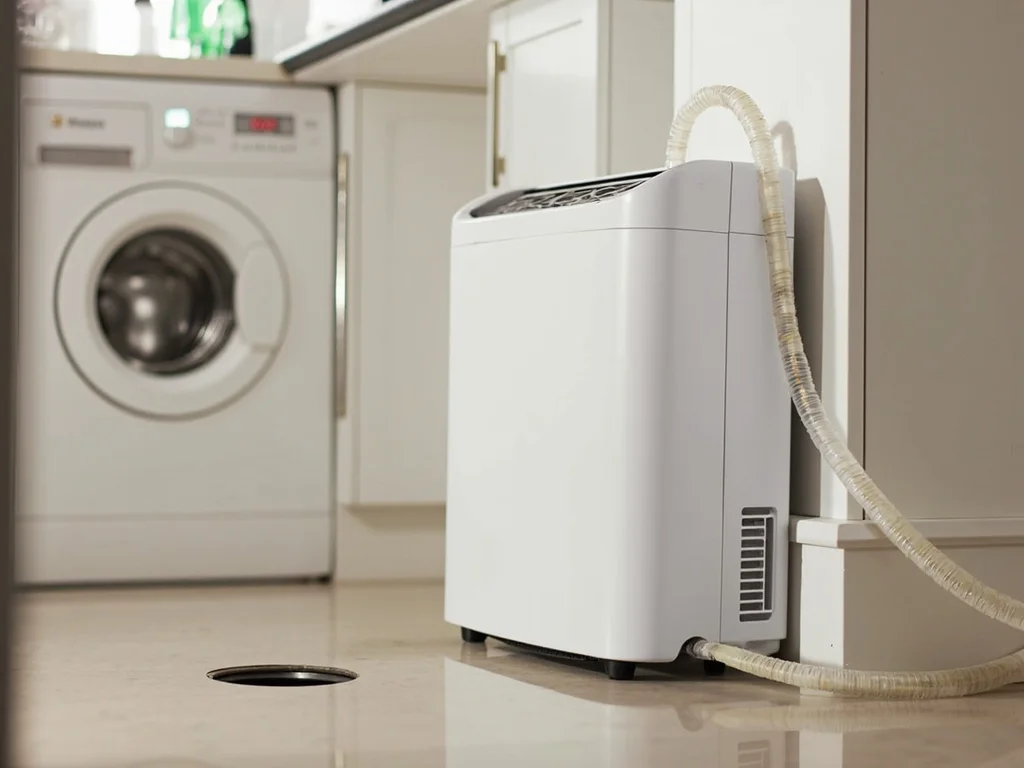 A dehumidifier drain hose connected for continuous drainage