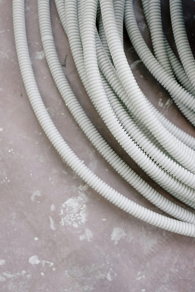 A dehumidifier drain hose connected for continuous drainage