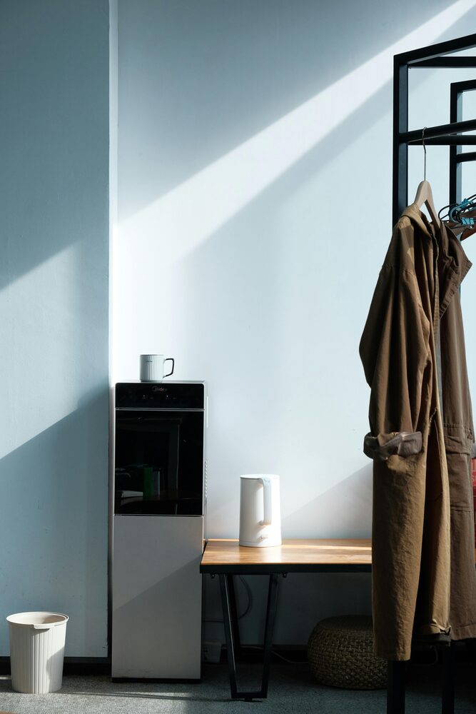 A portable dehumidifier placed with clear space around it in a room