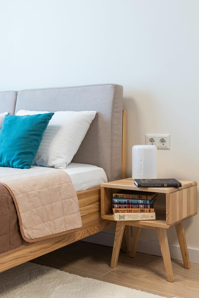 Small dehumidifier near a bedroom wall